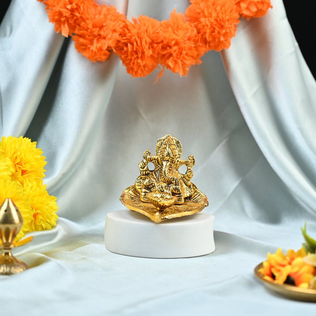 HindCraft Metal Lord Ganesha Idol on Leaf with Diya for Home & Puja Décor