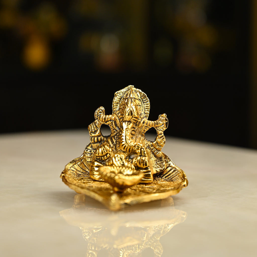 HindCraft Metal Lord Ganesha Idol on Leaf with Diya for Home & Puja Décor