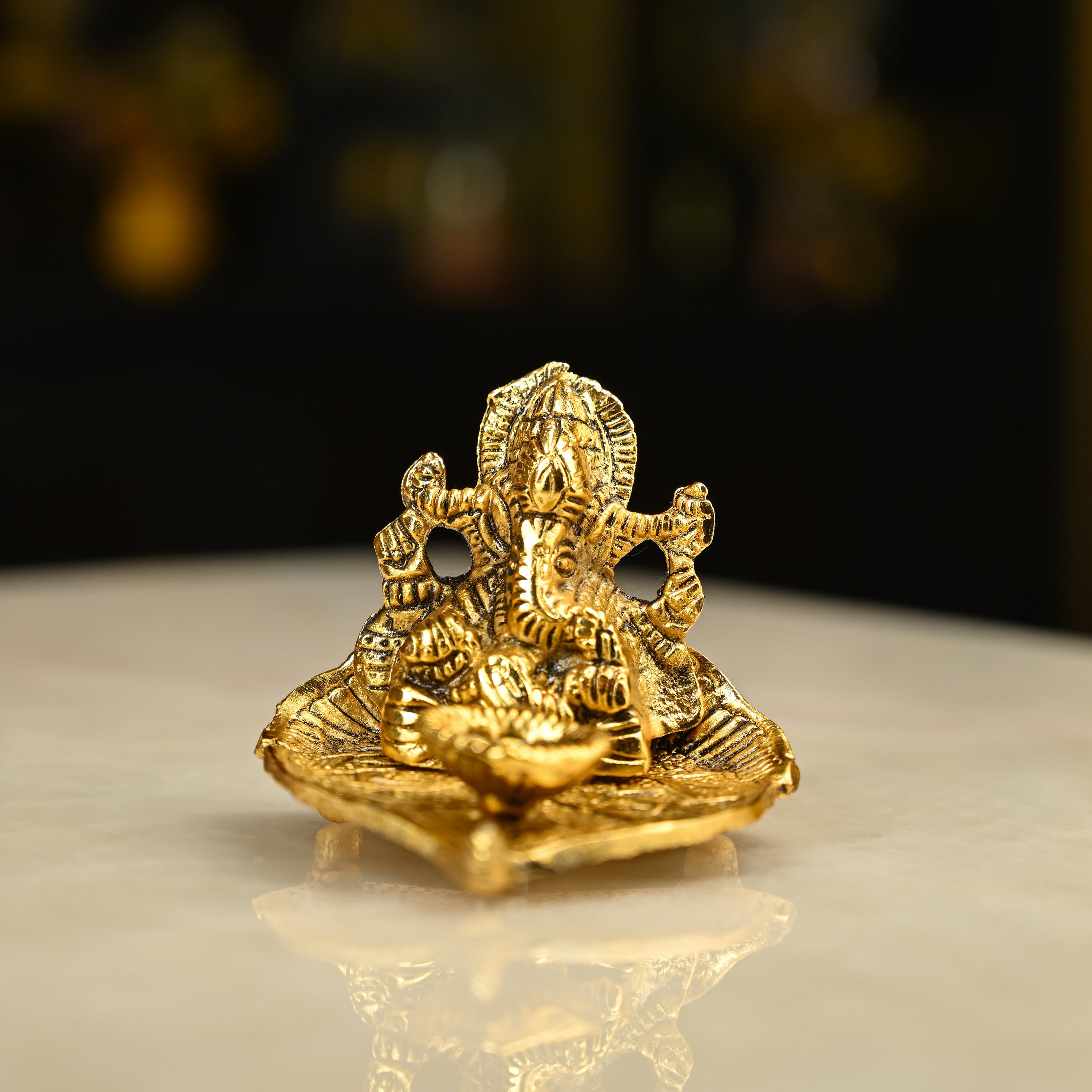 HindCraft Metal Lord Ganesha Idol on Leaf with Diya for Home & Puja Décor